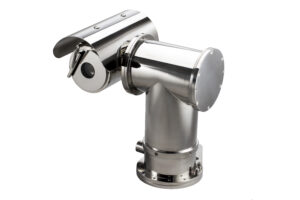 A professional-grade IVC APTZ-3045-09 pan-tilt-zoom (PTZ) camera designed for hazardous environments. The unit features a polished 316L stainless steel explosion-proof housing, a solid cylindrical base with heavy-duty mounting flanges, and an integrated protective sunshield over the high-precision lens