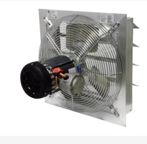 A heavy-duty Canarm AX24-4 industrial exhaust fan mounted on a grey corrugated metal wall. The unit features a circular galvanized steel housing with a wire mesh safety guard protecting the internal fan blades. Attached to the front are two horizontal aluminum shutters (louvers) in a partially open position, designed to regulate airflow and prevent backdrafts. A grey electrical junction box is mounted to the side of the fan housing for motor wiring