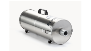 An industrial, stainless steel cylindrical vacuum cleaner with a black top handle and a central suction port, shown next to a black padded backpack harness designed to mount the unit for portable use in hazardous environments