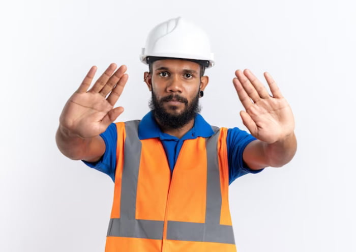 industrial worker signaling ‘stop’